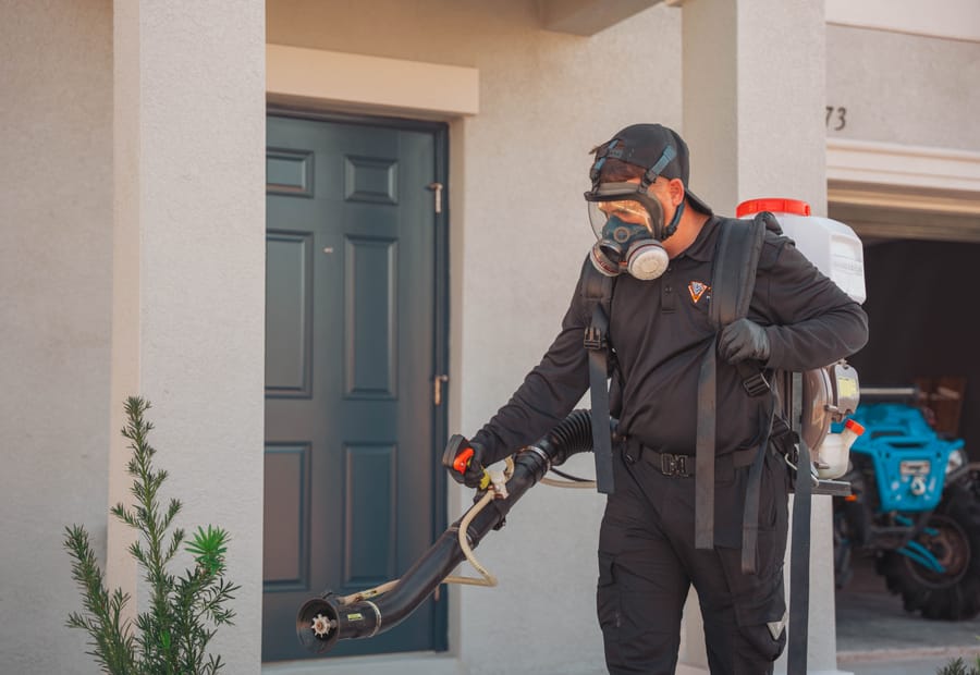 Taps technician spraying exterior pest control in Riverview, FL