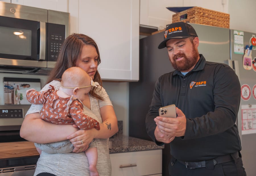 Taps technician with a Riverview family — pet and family-safe pest control