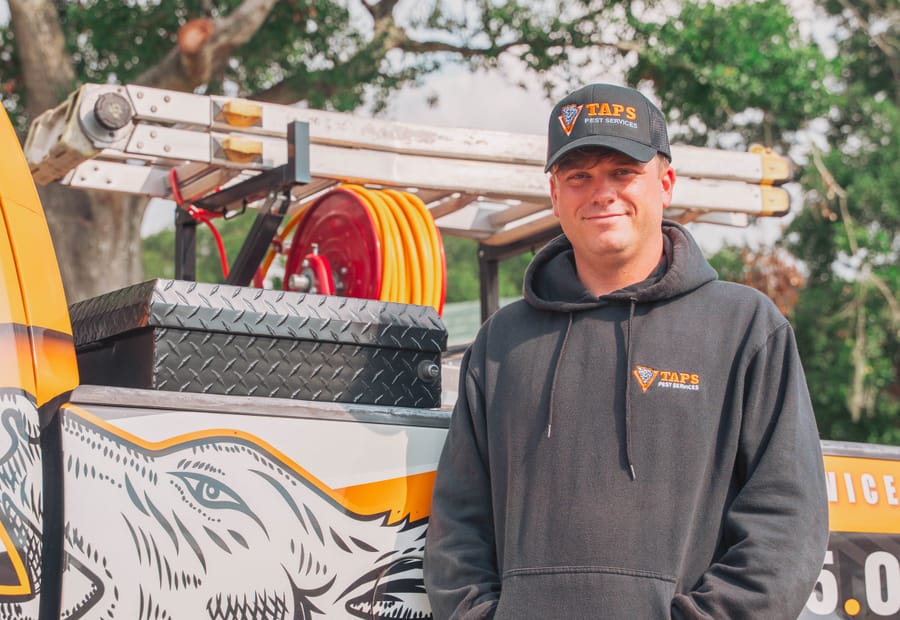 Taps technician with pest control equipment at the truck in Riverview, FL
