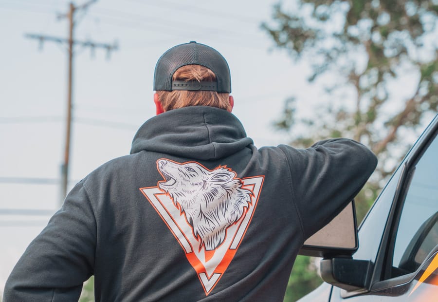 Taps Pest Services wolf logo on the team uniform, Tampa Bay