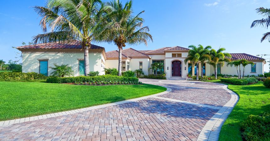 Pest Control in Bloomingdale, Florida — large residential home with landscaped driveway and palm trees