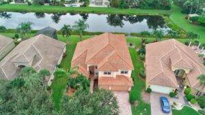 pest Control in Dover Aerial view of a beautiful home in Dover, Florida, near a lake, highlighting the need for expert pest control services for waterfront properties.